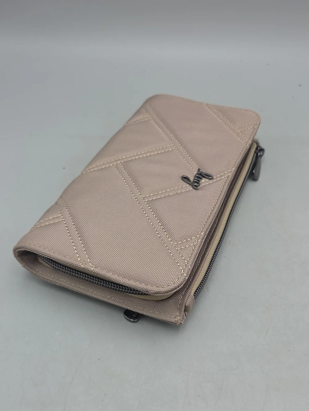 Lug Arabesque Ultra X Zip RFID Wallet in a sand Beige color